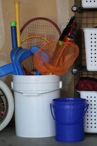 sports equipment in a bucket