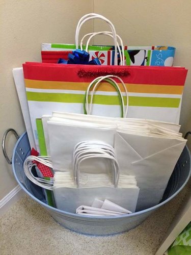 Gift bags organized in metal bucket
